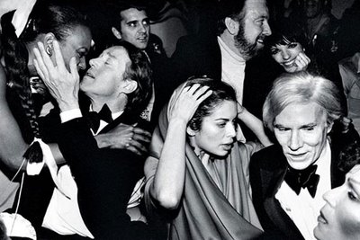 Bianca Jagger and Andy Warhol hobnobing with other fabulous folk.